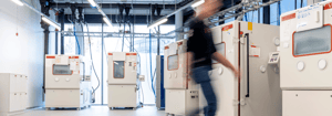 Reliability lab, man walking in environmental lab