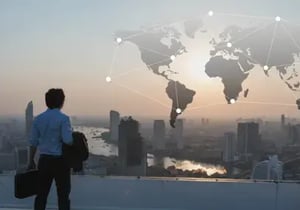 Man looking into a city-world map